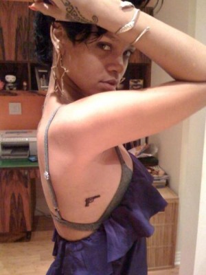 rihanna tattoos gun. Rihanna#39;s got two new guns.